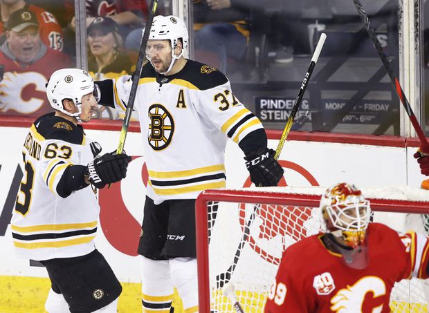 Bergeron stays hot with two goals as Bruins topple Flames 4-3