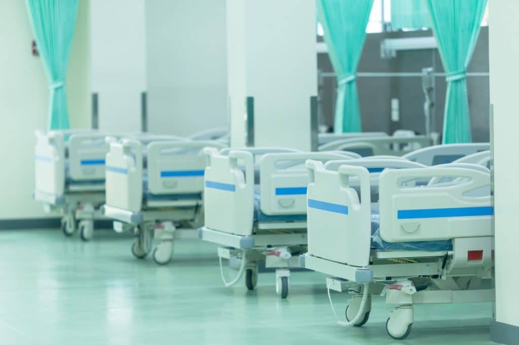 Hospital beds are lined up.