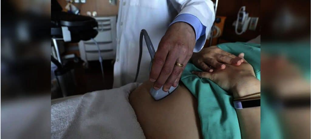 A patient is getting an ultrasound done.