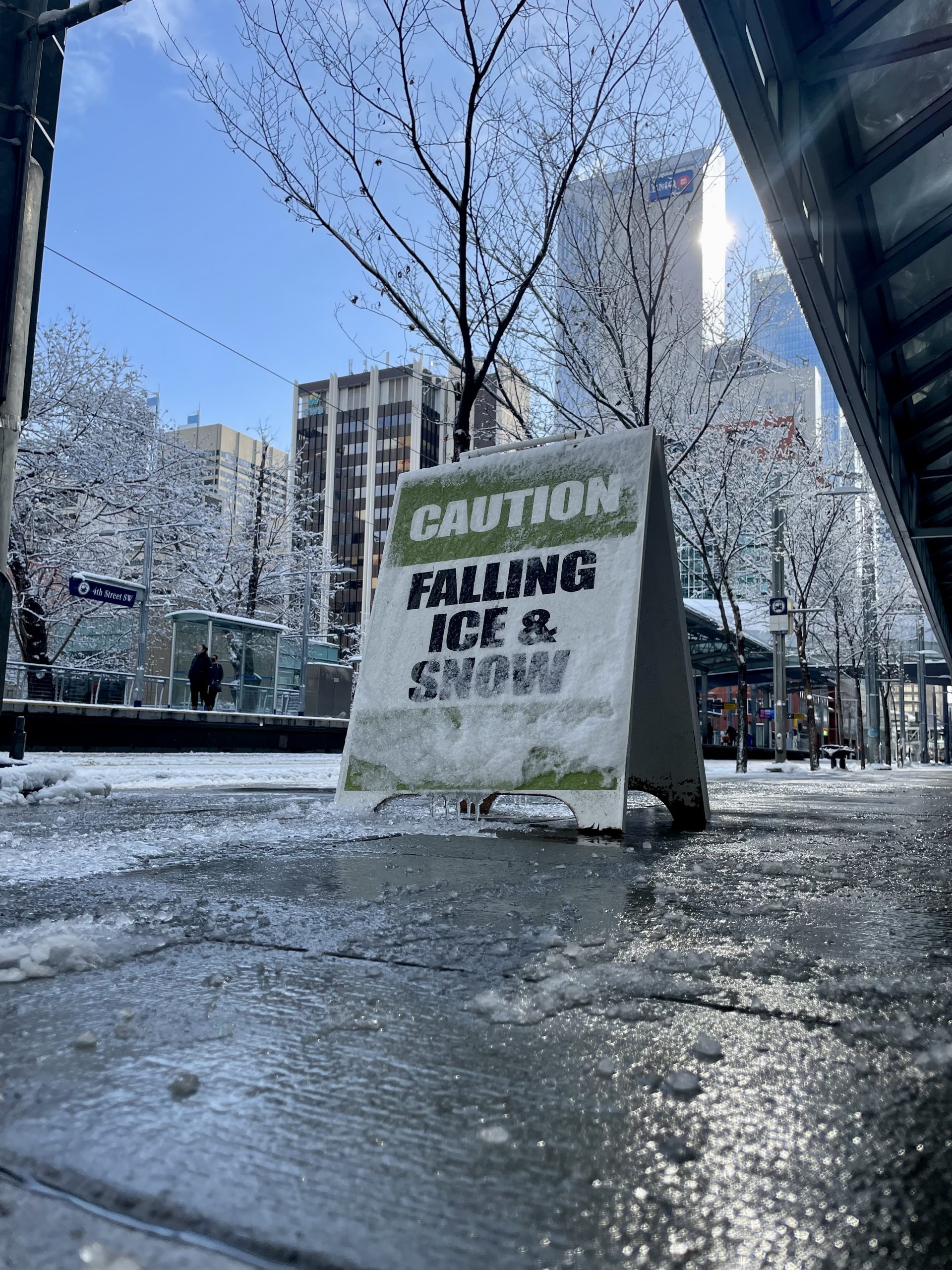 A sign warning of falling ice and snow