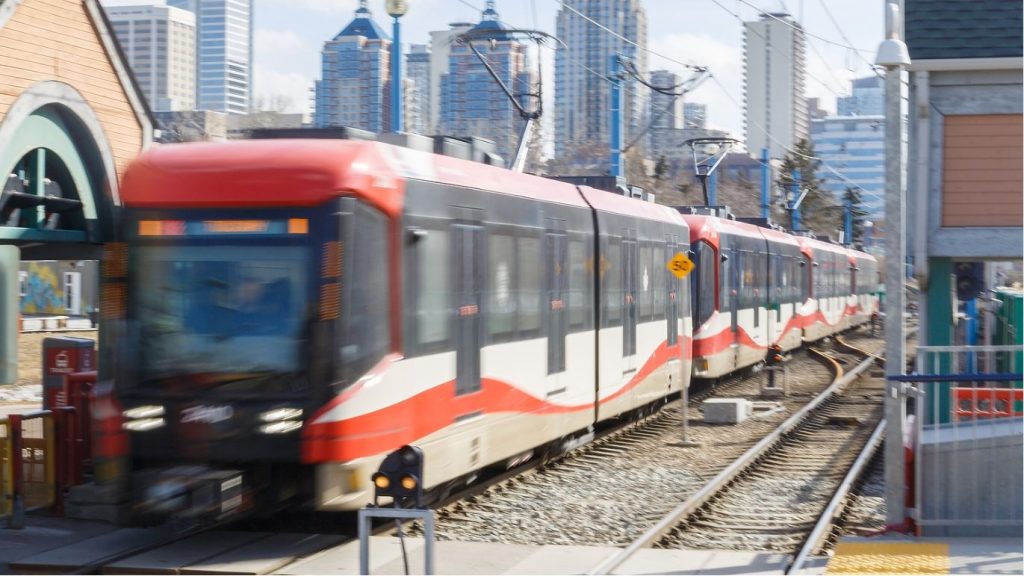 Tuscany destined train arrives at the Sunnyside station after leaving downtown Calgary in Calgary. Calgary's transit system is made up of two train lines, red and blue, that intersect at the stations downtown.