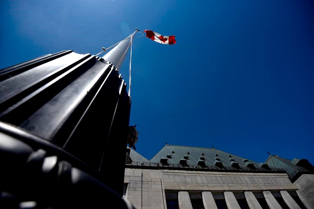 The flag flies in front of the Supreme Court of Canada in Ottawa, on Thursday, June 17, 2021.