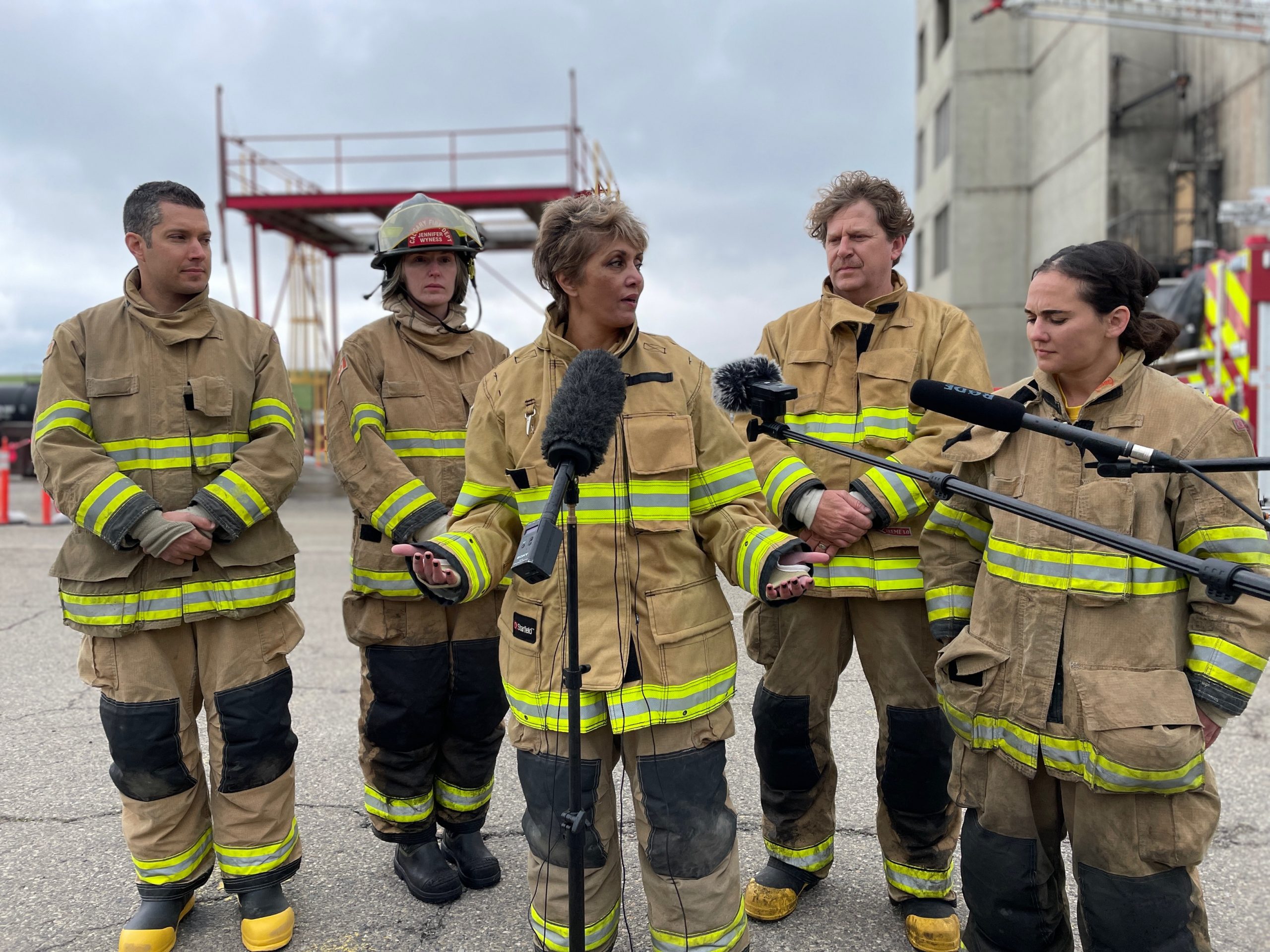 Mayor and council members in firefighting gear