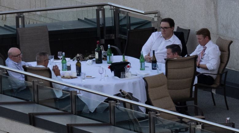 Photos of Alberta Premier Jason Kenney and members of the United Conservative caucus dining together on a rooftop patio are drawing disapproval from critics who say the politicians flouted the province's COVID-19 rules.