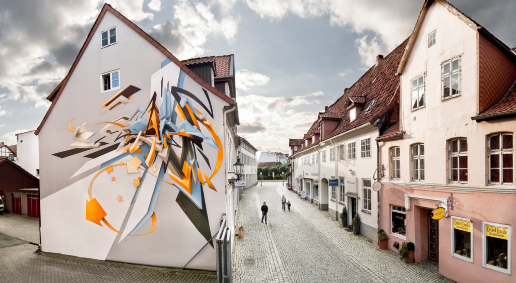 a painted mural on the side of a house