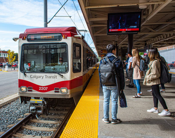 Students waiting for the LRT in Calgary at the Jubliee, SAIT, AUArts stop in autumn