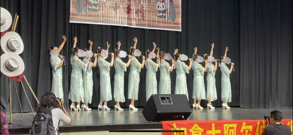 Performers on stage at the Calgary Chinese Cultural Association showcase during Stampede