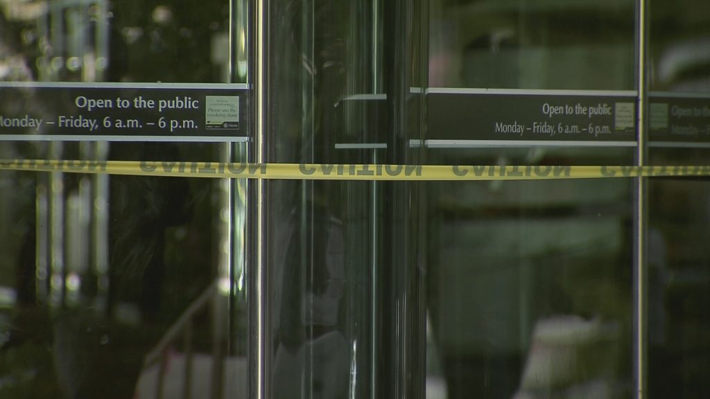 Police tape wraps over City Hall entrance
