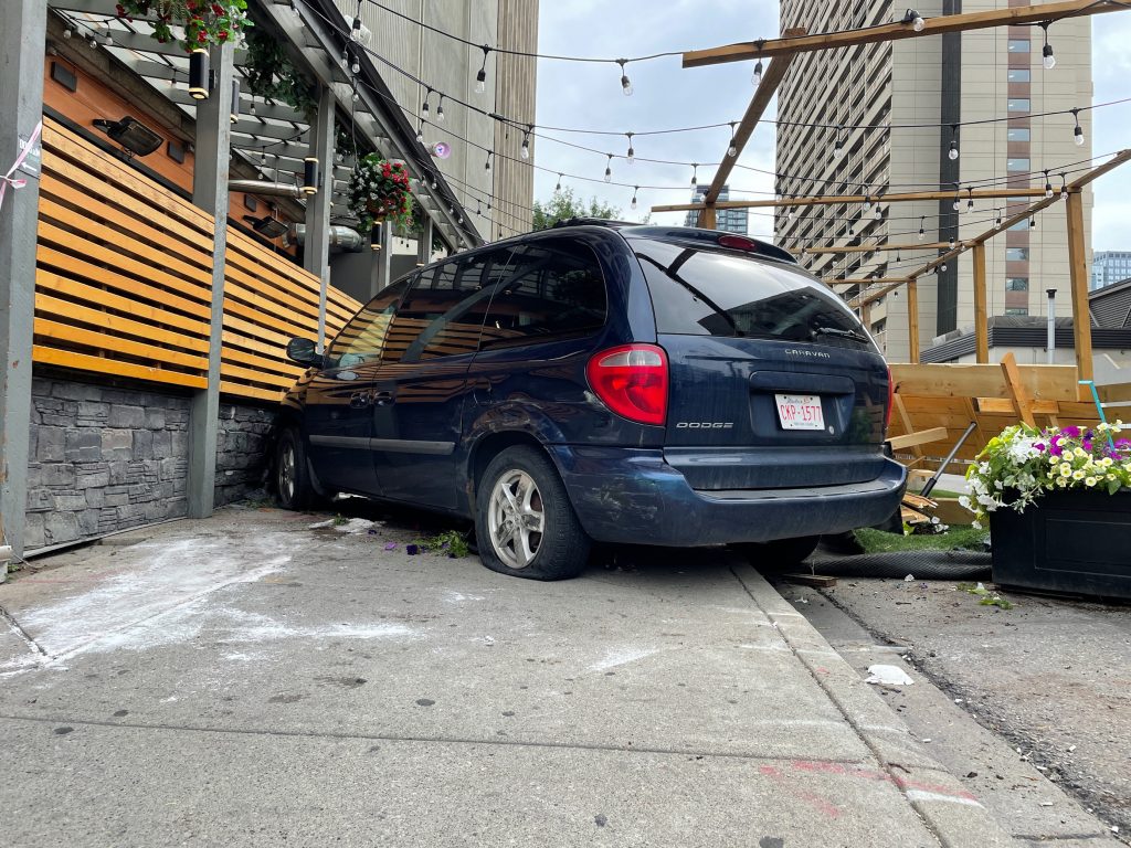 A minivan crashed into the patio at Bottlescrew Bill's Pub in Calgary's downtown on Thursday morning