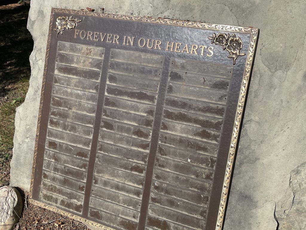 A grave with multiple plaques stolen at Queen's Park Cemetery in Calgary