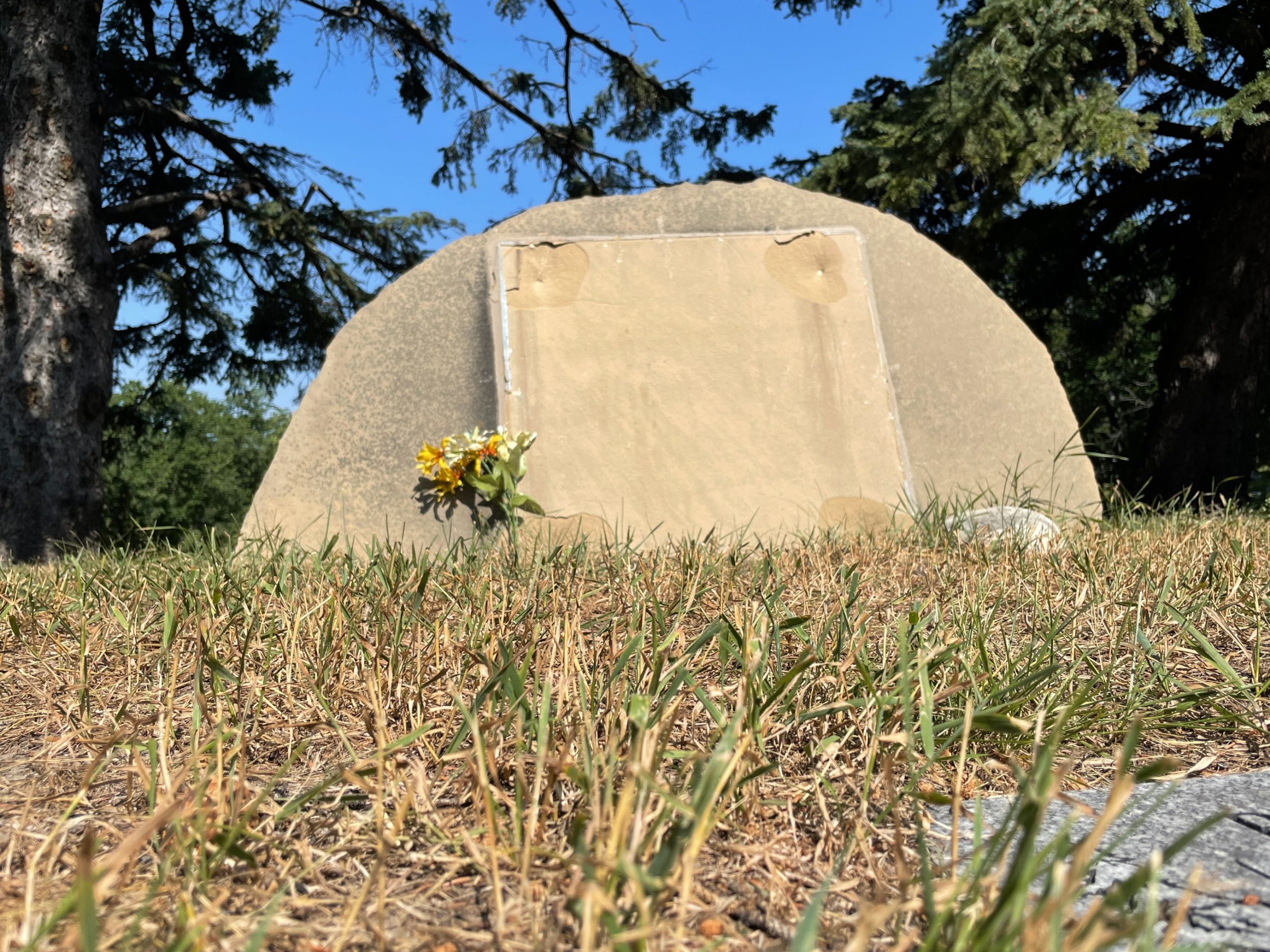 A grave with a plaque stolen at Queen's Park Cemetery in Calgary