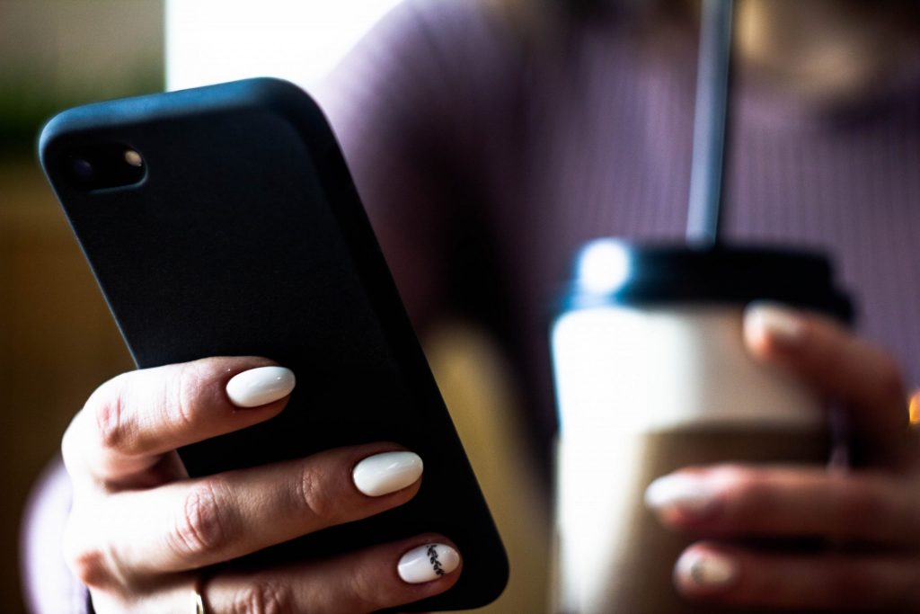 A picture of a woman holding cell phone