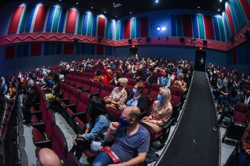 People sit to watch a film at the Calgary Film Festival inside Globe Cinema in Calgary