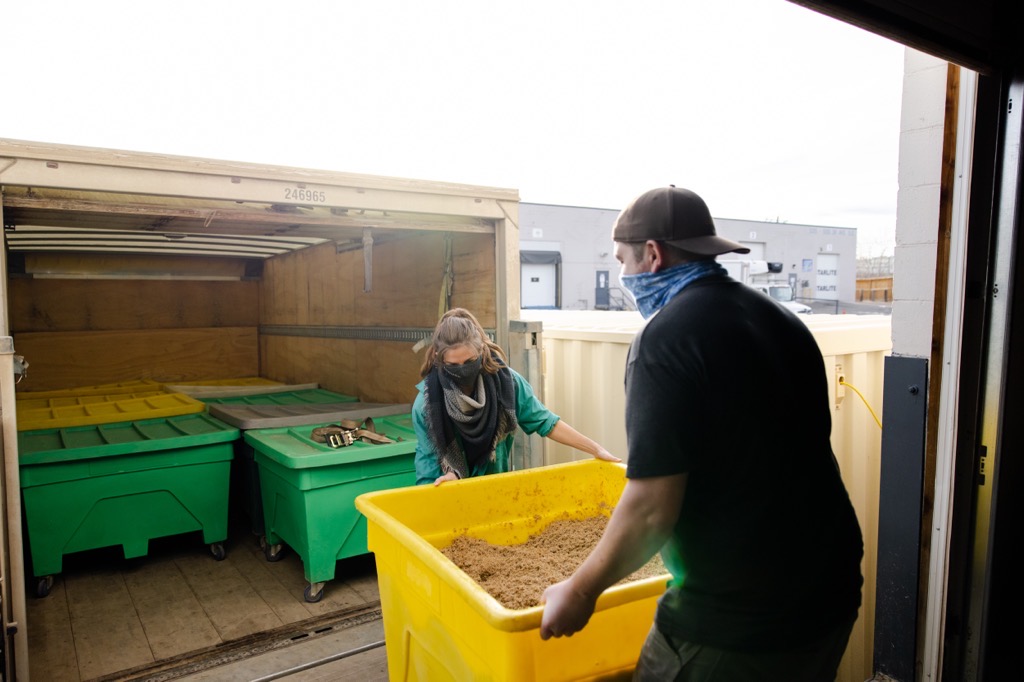 Victoria Ross, left, works with an employee at a farm with aGRO Systems Victoria Ross, left, works with an employee at a farm with aGRO Systems