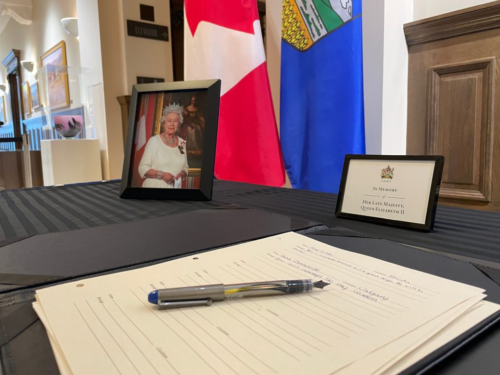 A desk is set-up at the McDougall Centre in honour of the late Queen Elizabeth II in Calgary