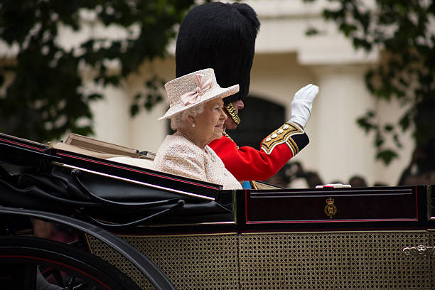 London, England - June 13, 2015: Queen Elizabeth II in an open carriage with Prince Philip for trooping the colour 2015 to mark the Queens official birthday, London, UK