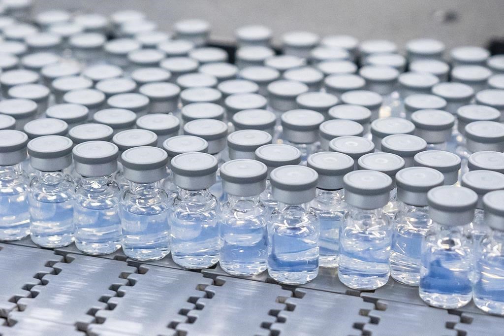 This August 2022 photo provided by Pfizer shows vials of the company's updated COVID-19 vaccine during production in Kalamazoo