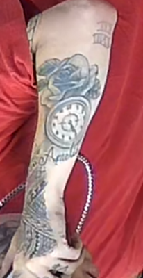 Arm tattoo of suspect in vehicle theft