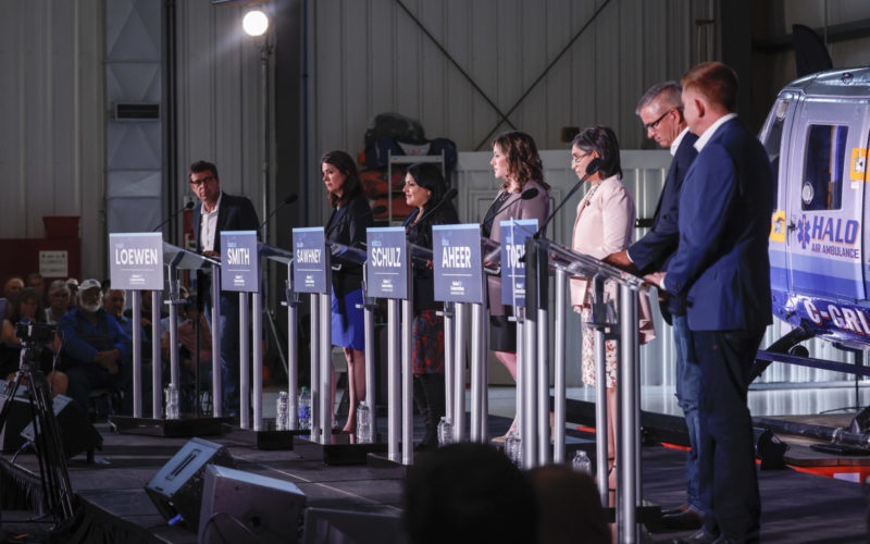 Candidates, left to right, Todd Loewen, Danielle Smith, Rajan Sawhney, Rebecca Schulz, Leela Aheer, Travis Toews, and Brian Jean, attend the United Conservative Party of Alberta leadership candidate's debate in Medicine Hat, Alta.