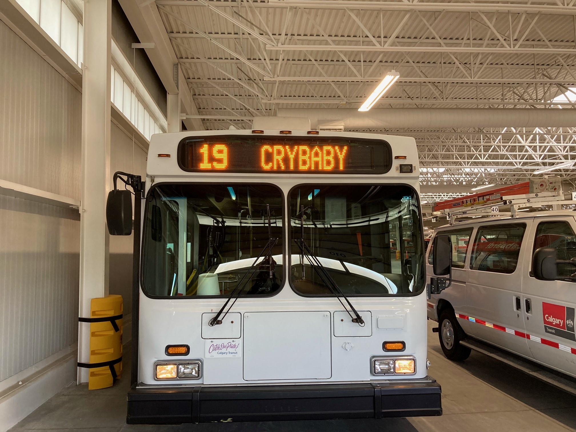 Calgary Transit bus with the name of the route "Crybaby" on the front