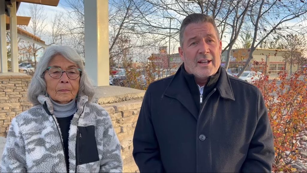 Alice Marchand, left, stands with Ward 13 Calgary Councillor Dan McLean in a video he shared to social media in Calgary