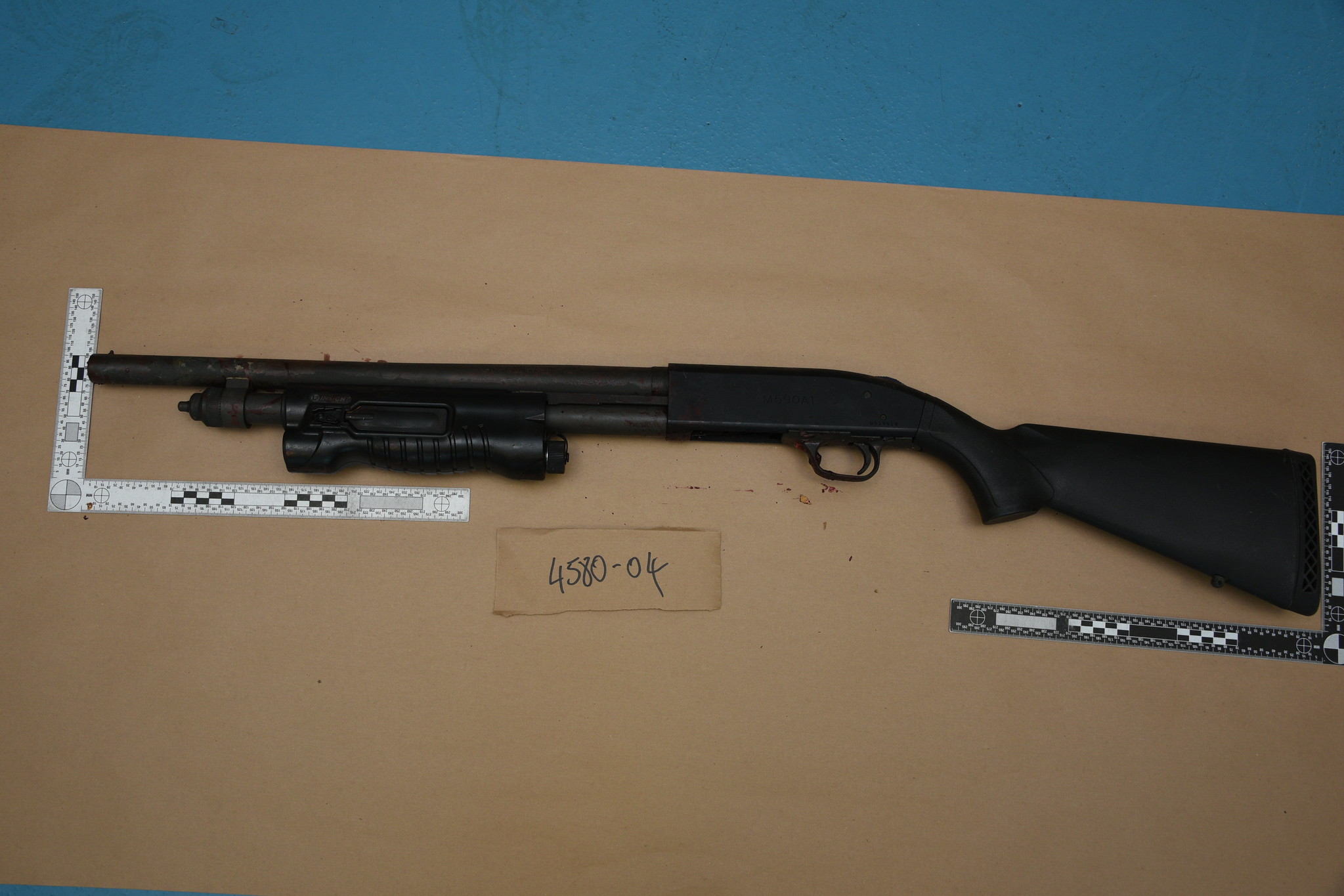 A photo of a shotgun found underneath a man in Calgary