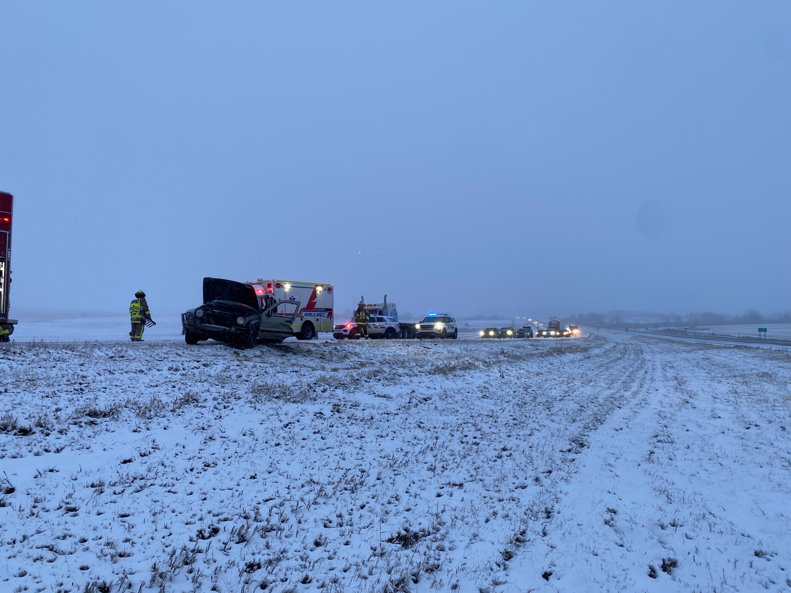 Emergency vehicles respond to a crash on Highway 1 