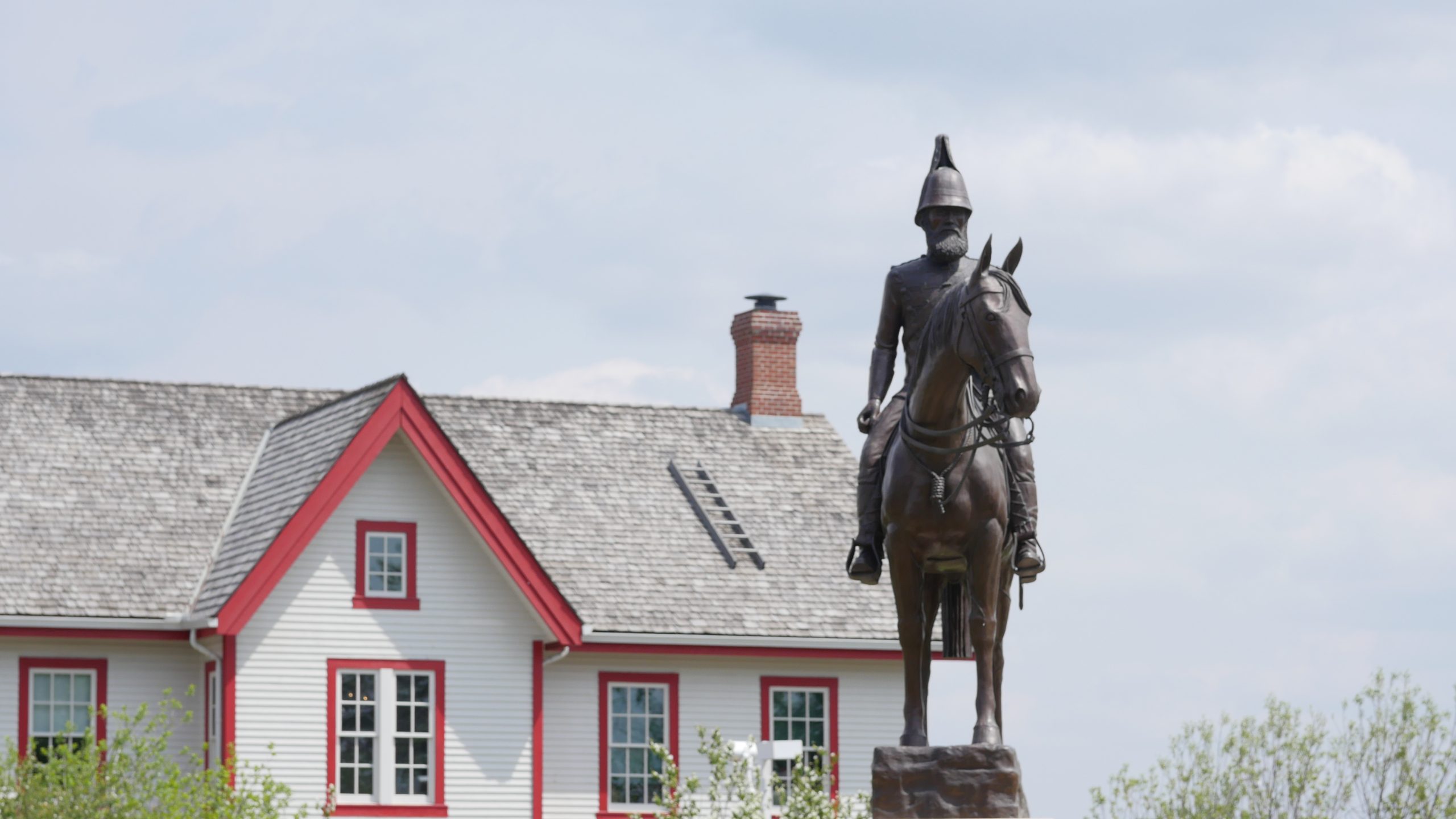 The statue of Lieutenant-Colonel James Macleod stands guard outside Fort Calgary