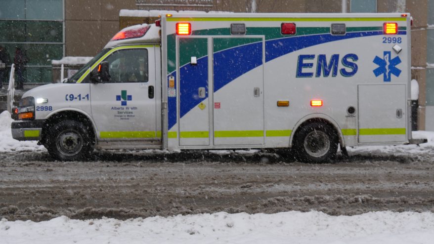 An ambulance on a snowy Calgary street