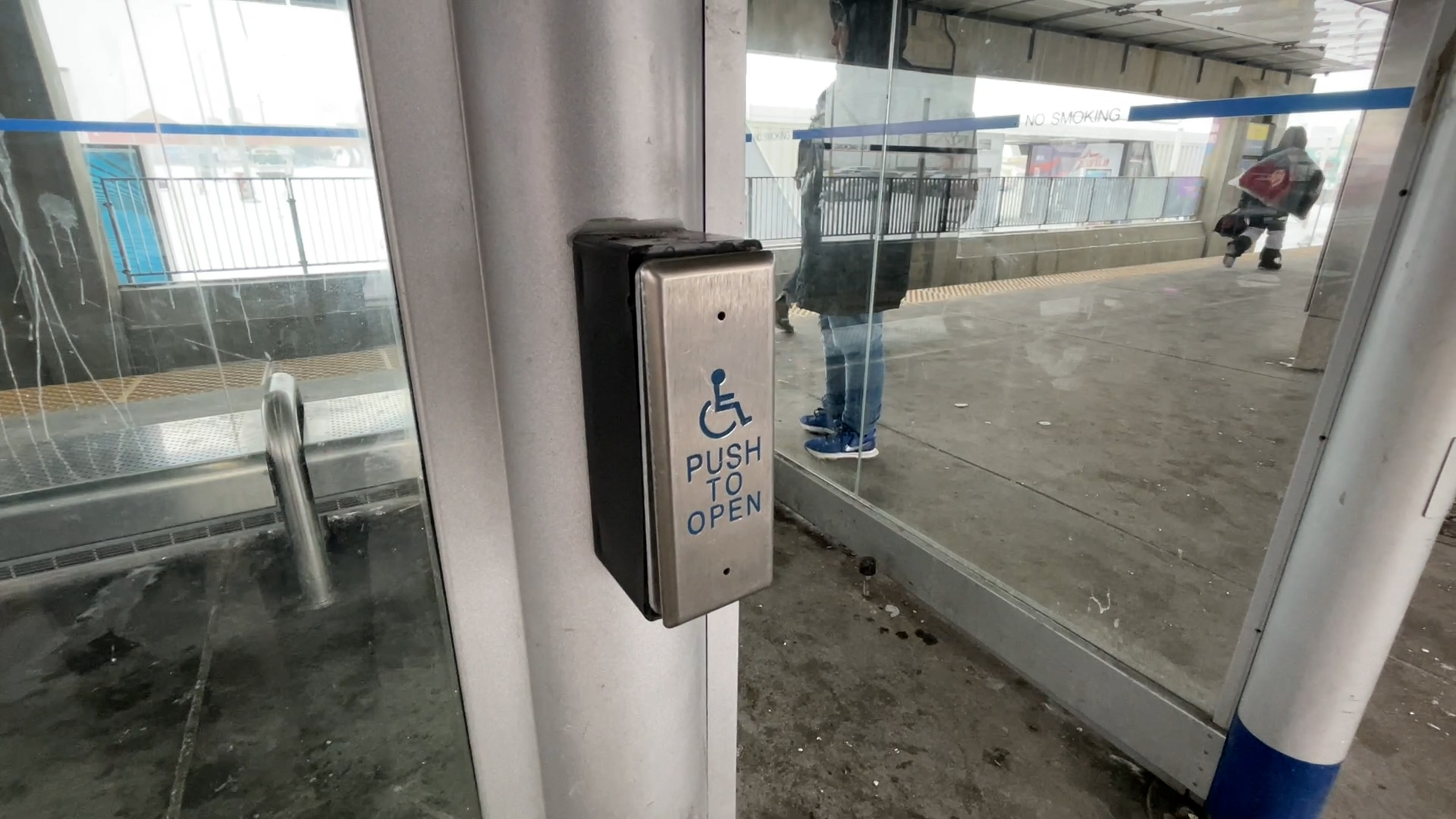 A button to open the door of one of Chinook LRT Station's outdoor shelters in Calgary