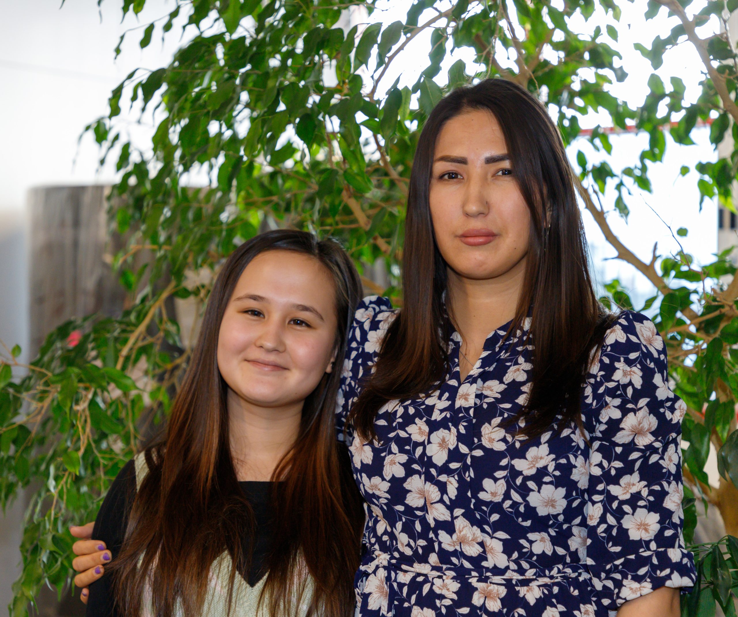 Mohabeesa Roshanian, left, poses for a photo with Fatima Roshanian inside Centre for Newcomers in Calgary