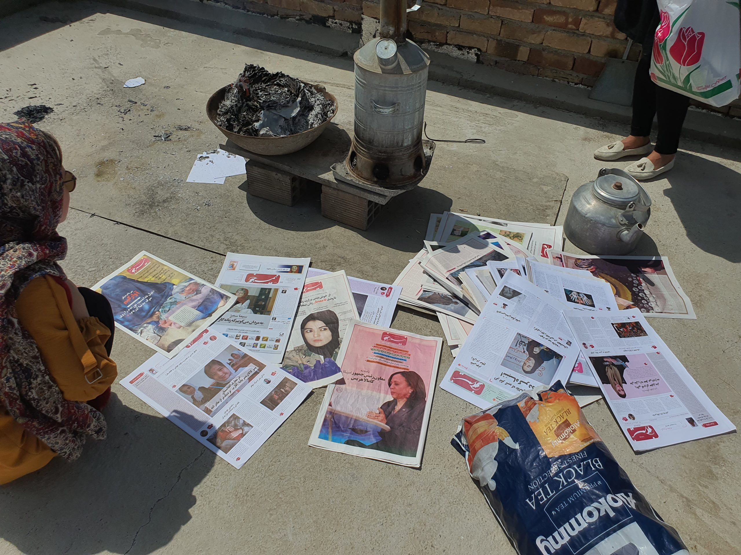 Newspapers of Nimrokh Media are scattered on the ground after several documents had been burned in Afghanistan