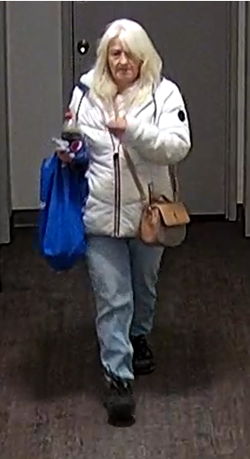 A photo showing a woman walking 