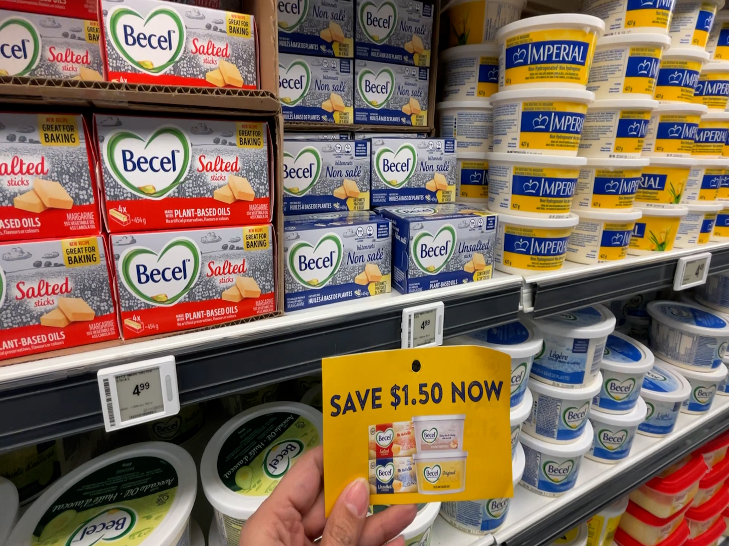 A coupon is shown hanging in an aisle.