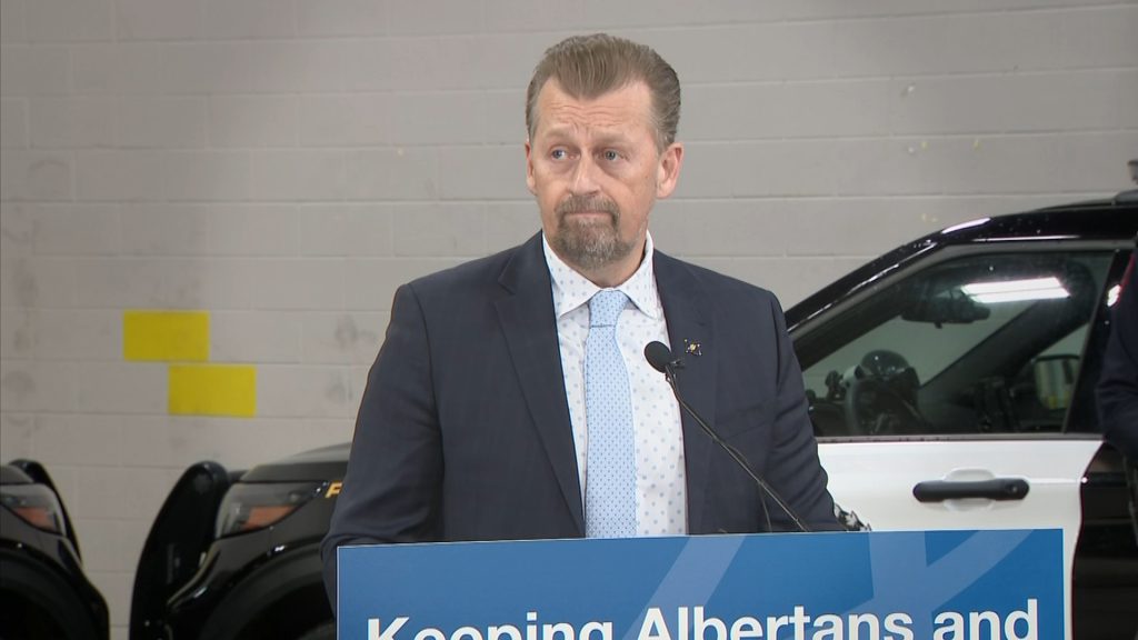 A photo showing Mike Ellis, Minister of Public Safety and Emergency Services laying a speech.