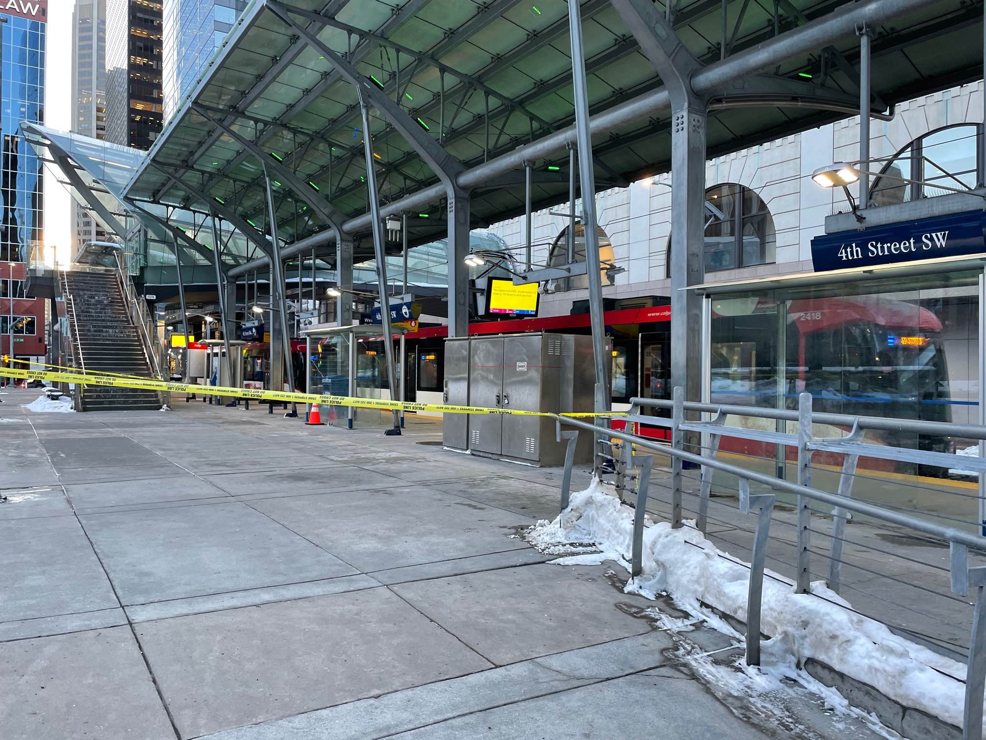 The 4 Street SW CTrain station is taped off in Calgary