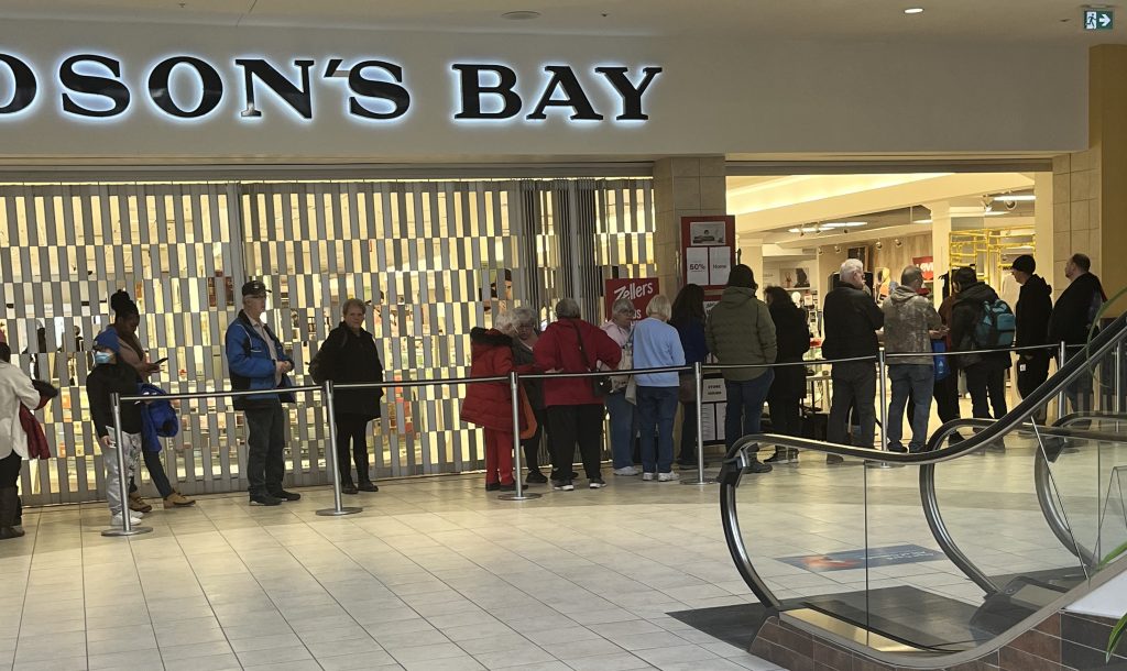 A line-up of people outside the Hudson's Bay in Sunridge Mall in Calgary