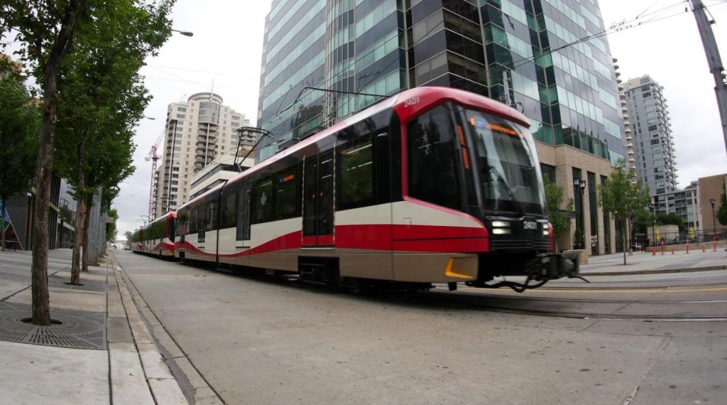 A CTrain makes it way along 7 Ave SW in downtown Calgary