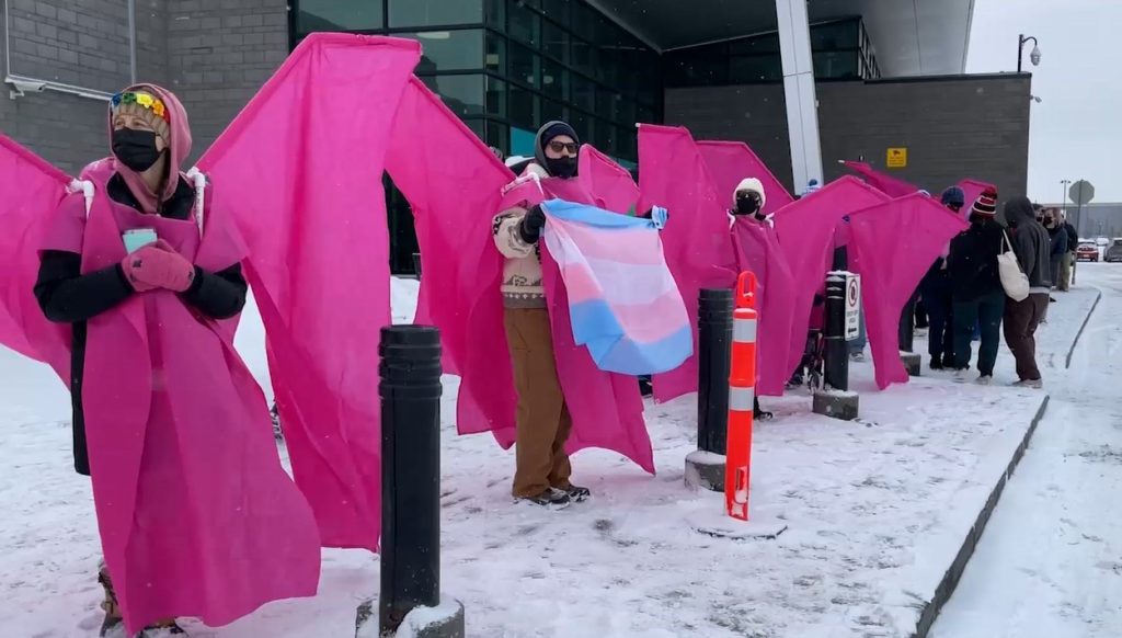Counter-protestors wearing pink wings as part of the Fairy Guardian Project outside the Country Hills Library at Vivo in Calgary