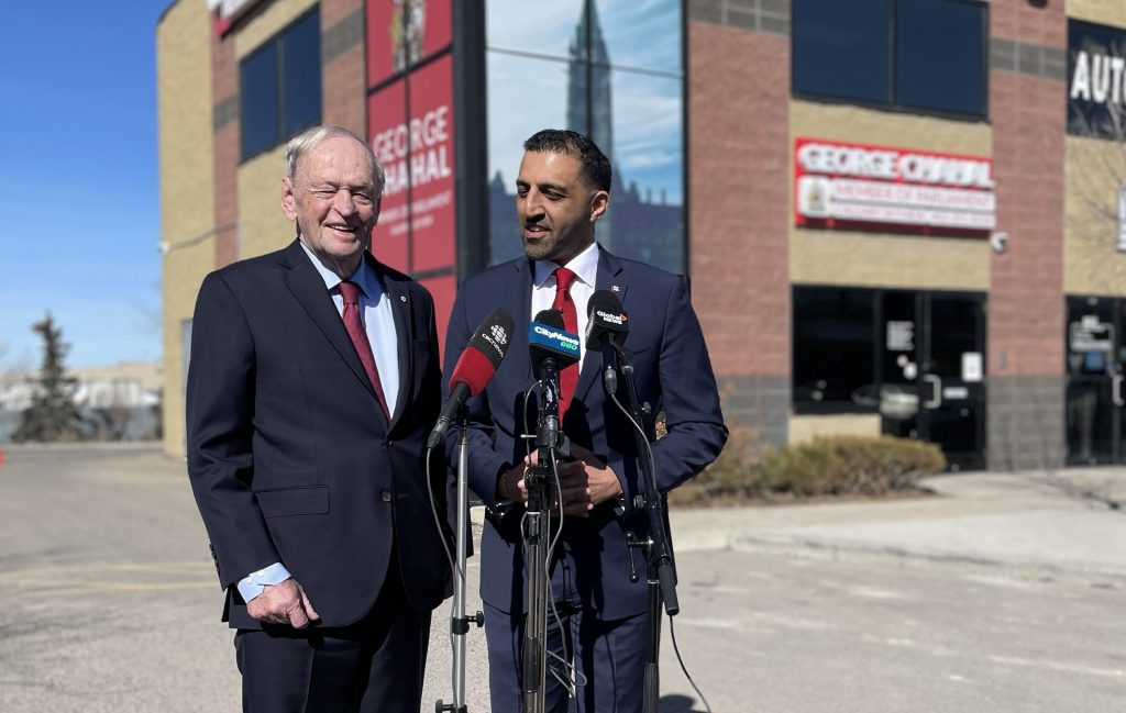 Former PM Jean Chrétien, left, stands with Liberal MP George Chahal in Calgary