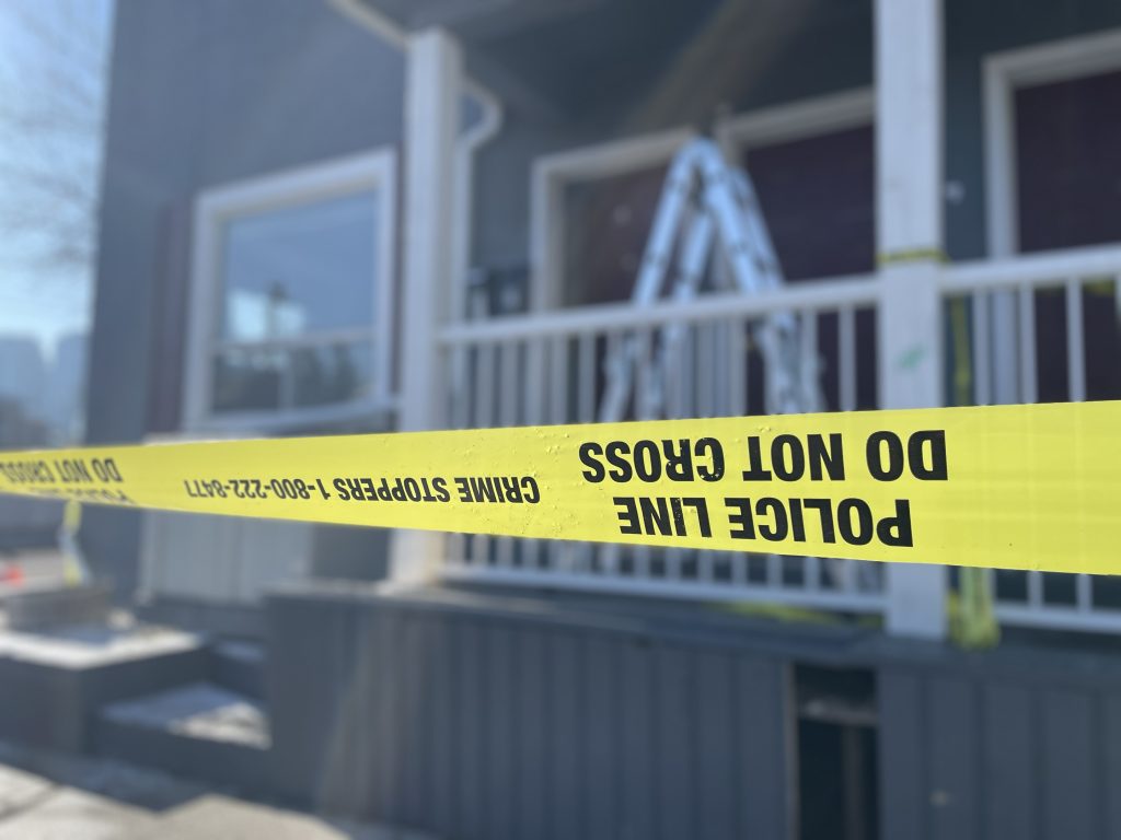 Calgary Police Service tape in front of the Lunenberg Apartments in the Sunnyside area in Calgary