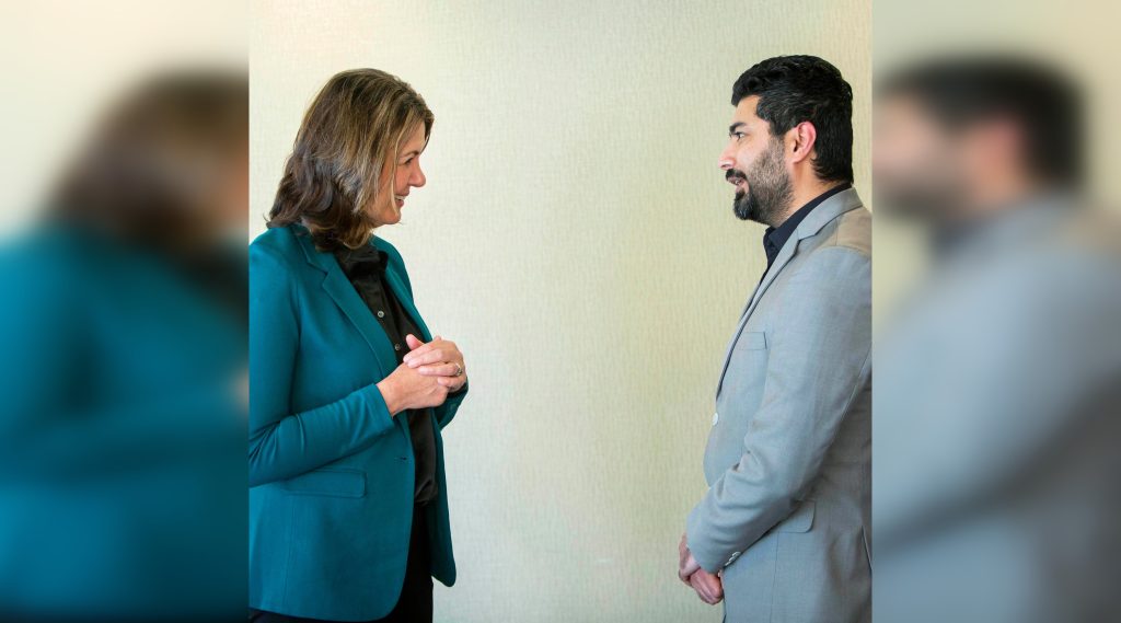 Alberta Premier Danielle Smith, left, and former United Conservative candidate for Fort McMurray-Wood Buffalo riding Zulkifl Mujahid pose together in a photo