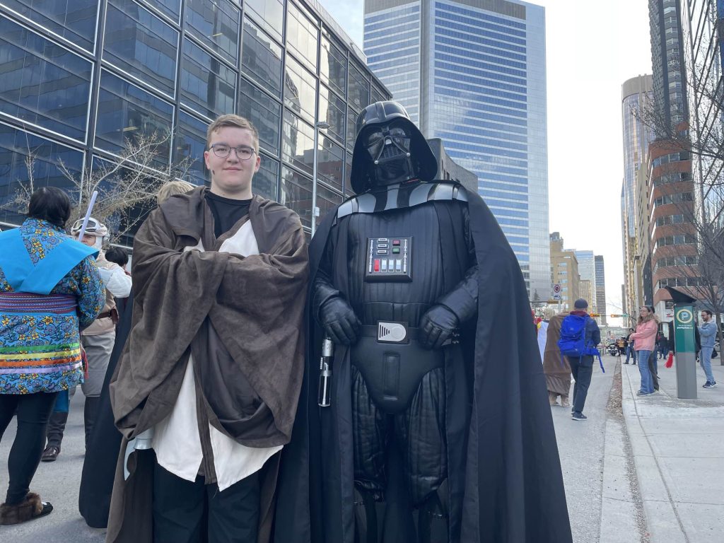 Darth Vader, right, poses with Obi-Wan Kenobi at the Parade of Wonders in Calgary on Friday, April 28, 2023. (Logan Stein, CityNews image)