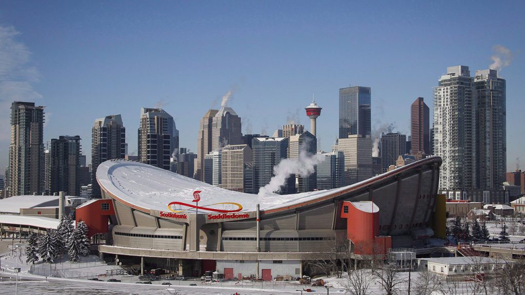 Steam rises from buildings near the Scotiabank Saddledome in Calgary, Alta.