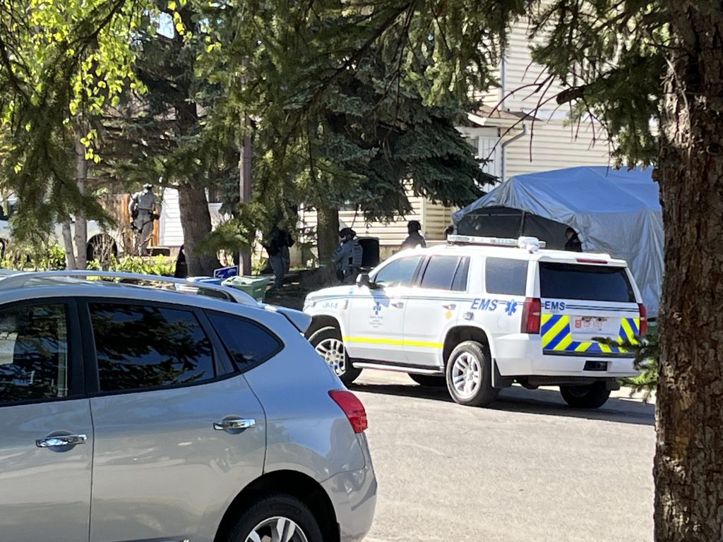 Calgary police outside a home on Fonda Way in southeast Calgary