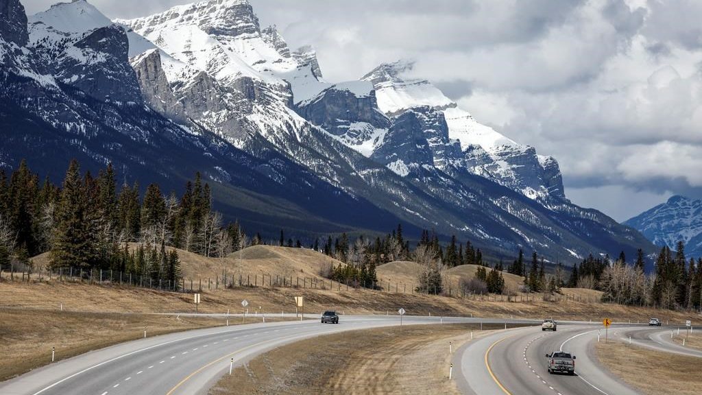 Traffic travels along the Trans Canada Highway past Mt. Rundle near Canmore, Alta., Monday, April 24, 2023.THE CANADIAN PRESS/Jeff McIntosh
