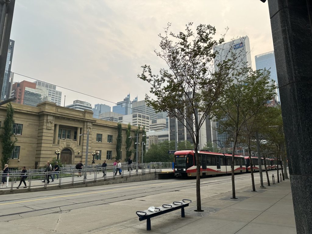 Environment and Climate Change Canada (ECCC) has issued a special air quality statement for Calgary for Thursday, July 13, 2023. Smoke lingers in the air as commuters move along 5 Street and 7 Avenue in downtown Calgary.