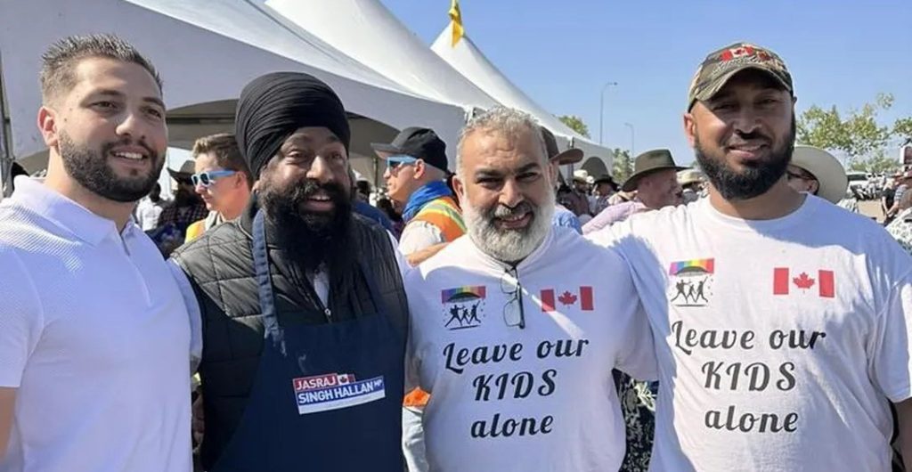 Calgary-Forest Lawn MP Jasraj Singh Hallan pictured with Mahmoud Mourra (centre) who is facing charges of hate-motivated criminal harassment.
