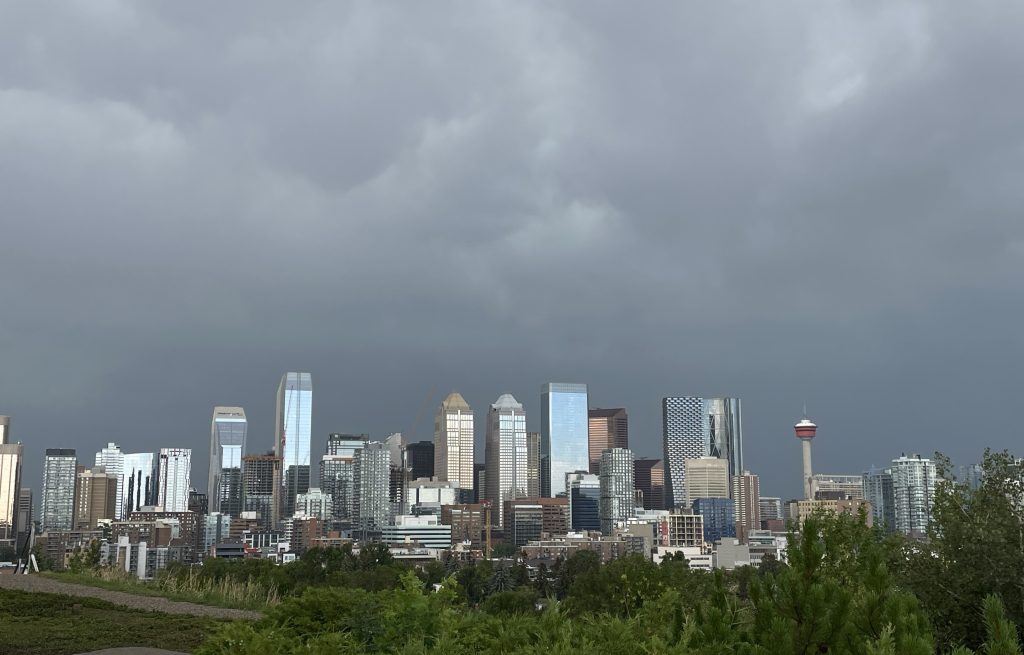 Dark storm clouds pelts downtown Calgary