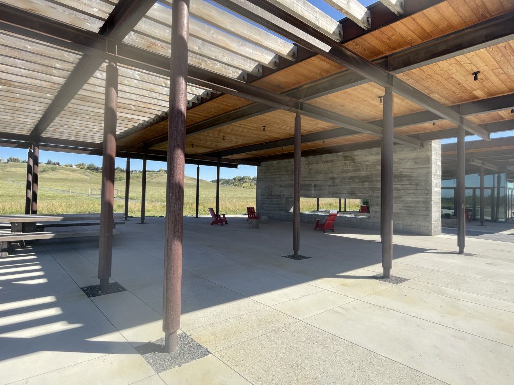 A wide angle photo of an area where people can rest at Haskayne Legacy Park in Calgary